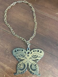 Travel-Bureau-butterfly-medallion